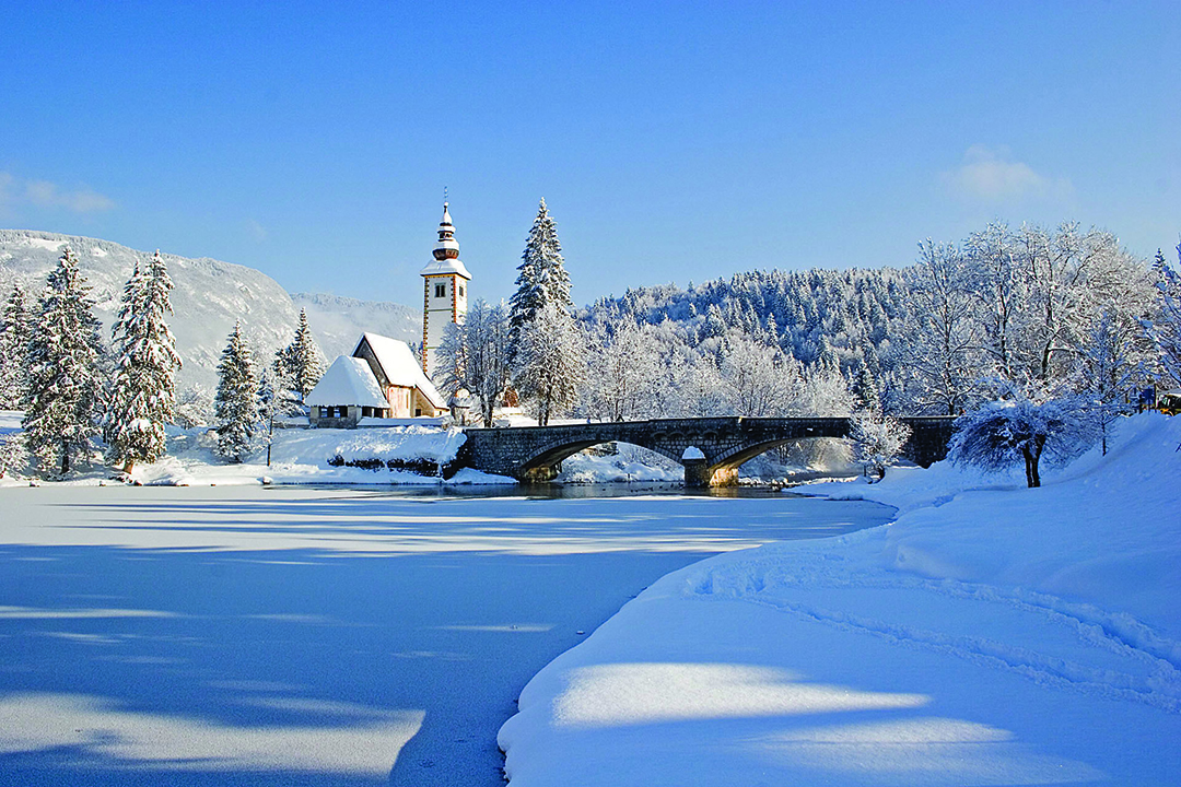Church_of_St-_John_the_Baptist_at_Bohinj_lake_in_winter_-_Photographer_-_Turizem_Bohinj_arhiv_-_Source_-_www-slovenia-info.jpg