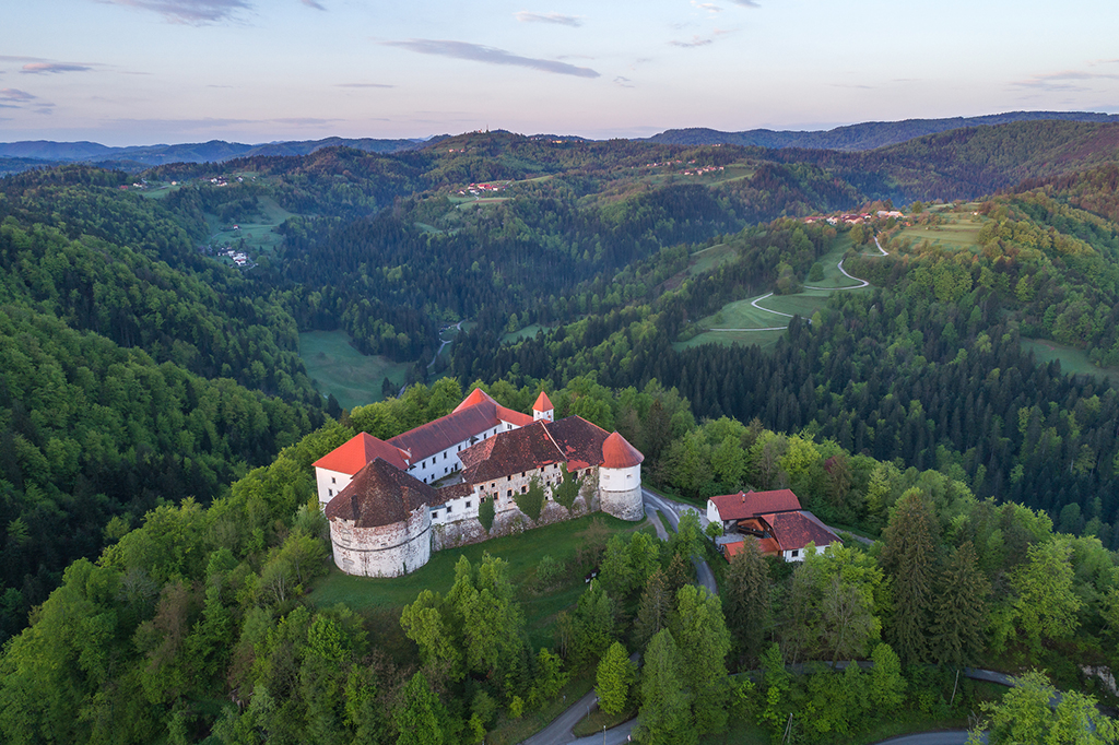 Castle_Turjak_amidst_green_landscape_-_Photographer_-_Jost_Gantar_-_Source_-_www-slovenia-info.jpg